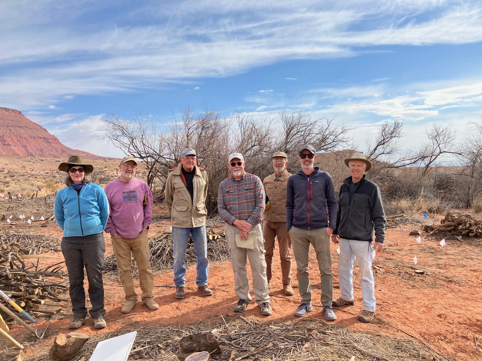 DPI Volunteers standing together in a line outside in the desert