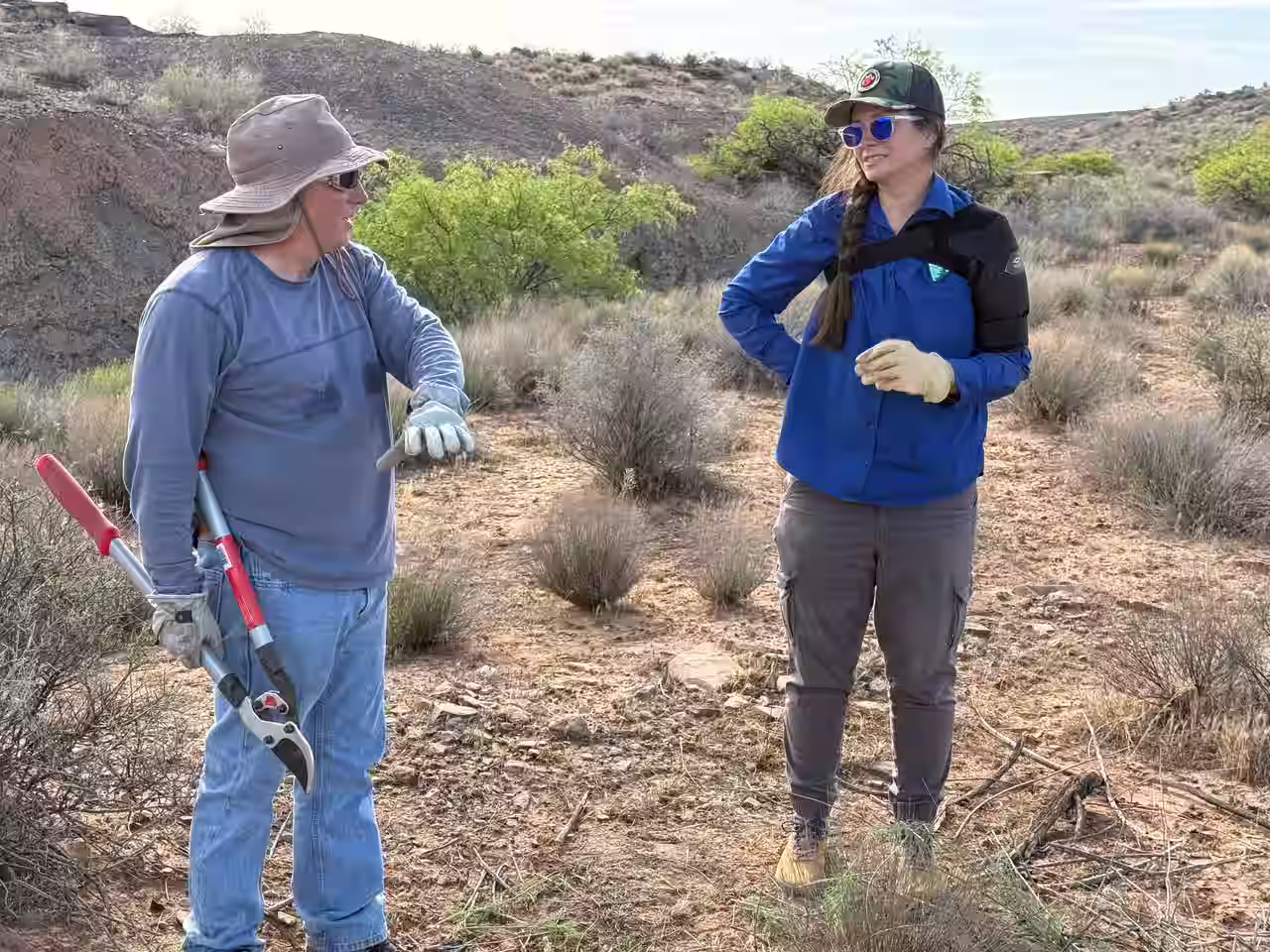 Stephanie Taylor, Wildlife Biologist for the BLM in St. George, Utah, stands talking with a member of Desert Preservation Initiative